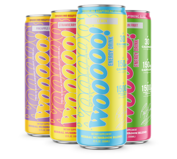 A lineup of the Wooooo! Energy flavor collection. From left to right: Purple Pineapple Berry, Red Strawberry Banana, Yellow Lemon, and Green Dragon Fruit cans, showcasing the cohesive vibrant branding and functional mushroom ingredients.